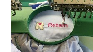 New healthcare Assistant uniforms being embroidered 